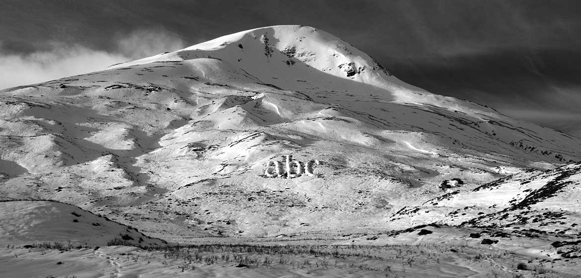 Link to Melt project by Michael Cross. Image shows the letters ABC made of piled up snow on a hillside